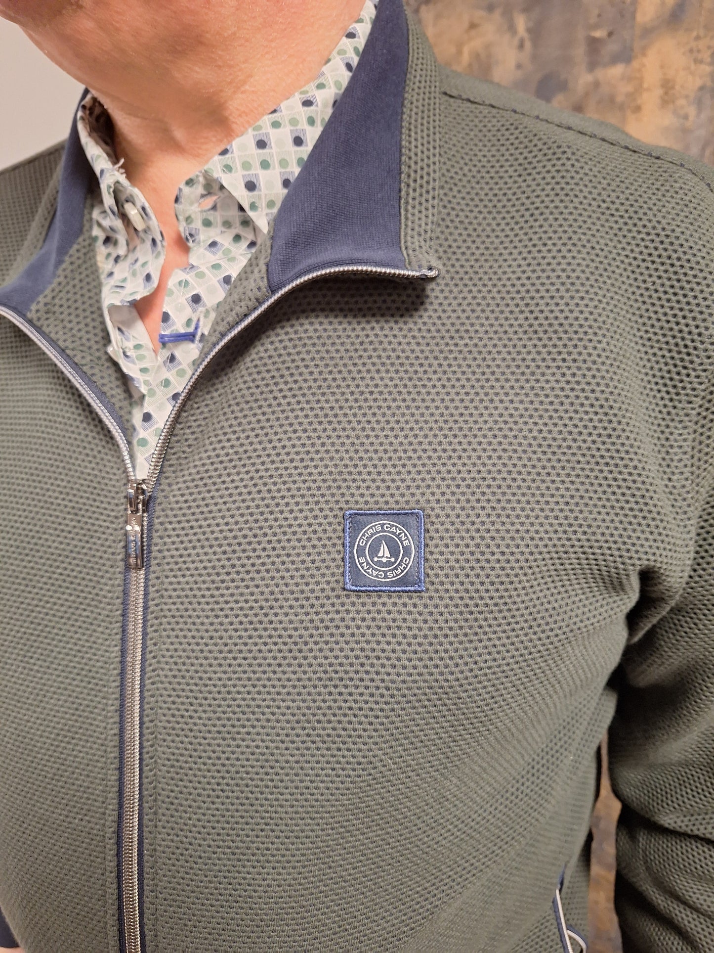 Chris Cayne groen vest